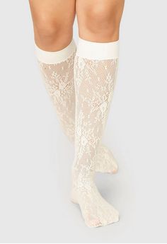 ROSA Lace Ivory Knee Highs by Swedish Stockings. Designed in Sweden and made in Italy. The ultimate accessory this season, let these ivory lace knee highs peek out from under jeans or trousers — or style them with all your dresses and skirts for a fashion-forward look. Here’s why you’ll love Rosa Lace Knee-Highs: Lace knee-highs Soft and broad cuff Knitted from regenerated yarn Produced by Calze Ileana S.p.a. Made in Italy 94% ECONYL® recycled polyamide, 6% creora® elastane One Size. Please wash White Lace Thigh-high Legwear, Fitted Feminine White Legwear, Fitted White Feminine Legwear, Spring Lace Legwear With Stretch, Spring Lace Stretch Legwear, Spring Thigh-high Legwear With Lace Trim, Fitted White Knee-high Socks For Summer, White Fitted Knee-high Socks For Summer, Spring Stretch Lace Legwear