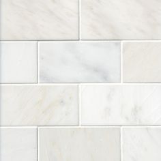 a white marble tile wall that looks like it is made out of tiles