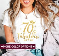 a woman sitting on a couch wearing a white shirt with the words 70 fabulous colors