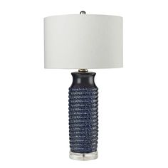 a blue lamp with a white shade on it