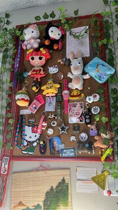 a bulletin board covered in lots of different items and stickers on top of it