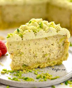 a piece of cake with white frosting and pistachio sprinkles