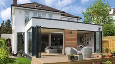 an outdoor living area with patio furniture and wooden decking