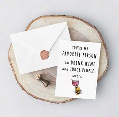 an envelope with a card saying you're my favorite person to drink wine and judge people with