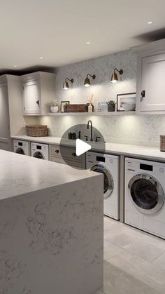 an image of a kitchen setting with washer and dryer in the foreground