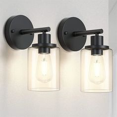 two lights that are on the side of a wall