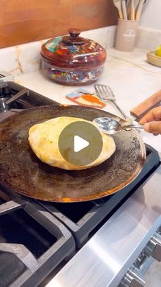 someone is cooking food on an iron skillet in the middle of a kitchen counter