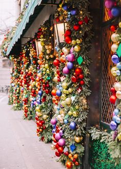 christmas decorations on the side of a building