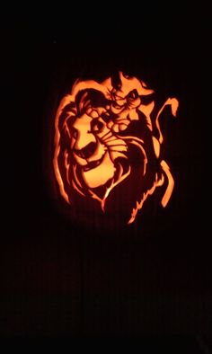 a carved pumpkin in the shape of a lion