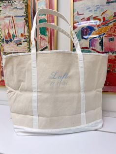 Your summer travel tote just got a whole lot cuter ;) Please pick between our four signature fonts! Embroidery is included in the price of the tote! Dimensions: 22.5x5.25x14.5inches CUSTOMIZATION, PLEASE READ: If Monogram Font please enter your initials in the order they should be monogrammed! Example: Kendall Leigh Beykirch is KBL (Last name in the center) + only pick one thread color! If colorblock please enter TWO initials MAXIMUM! + pick two thread colors If script or everyday font - please Summer Beige Bag With Embroidered Logo, Beige Embroidered Logo Bag For Summer, White Travel Bag With Embroidered Logo, Summer Rectangular Bag With Embroidered Logo, Personalized Cotton Canvas Travel Bag, Cotton Canvas Travel Bag With Embroidered Logo, Cotton Canvas Bag With Embroidered Logo For Travel, Personalized Cotton Canvas Bag For Travel, Travel Canvas Bag With Embroidered Logo