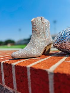 These scream Nashville!! Western-inspired ankle boot with all-over rhinestone detail. Synthetic leather / rhinestone upper. Manmade outsole. 7 in / 17.78 cm shaft height. 12 in / 30.48 cm boot opening. 2.5 in / 6.35 cm heel. Textile lining. Padded insole. Zipper closure. Clear Rhinestones, Synthetic Leather, Scream, Nashville, Ankle Boot, Zipper, Heels, Boots, Leather