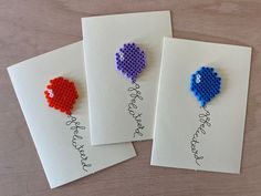 three greeting cards with beaded balloons on them