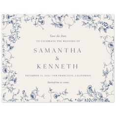 a wedding card with blue and white flowers on the front, in an ornate frame