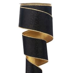 a roll of black and gold ribbon on a white background