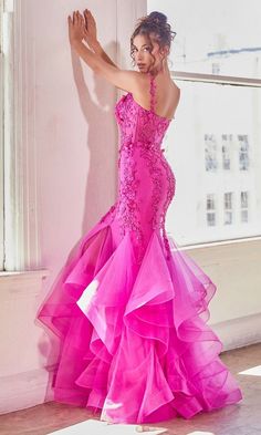 Standout in a crowd wearing this bright fuchsia pink long prom dress. Beaded lace applique makes this hot pink prom dress sparkle from the v-neckline to the knees for an eye-catching look at prom, pageants, and other formal events. The long pink evening gown has a mermaid skirt that hugs the hips before ruffled tiers flow to the floor to complete the design. Slip into this bright pink long prom dress for your exciting event and watch heads turn. Kentucky Derby Dress, Dramatic Silhouette, Race Outfit, Prom Dresses Long Mermaid, Cinderella Divine, Derby Dress, Prom Long, Trumpet Skirt, Sleeveless Gown