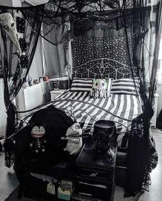 a black and white bedroom with lots of decorations