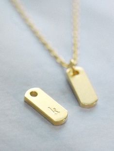 "An everyday staple, the perfect personalized initial necklace or a meaningful symbol as a daily reminder. Each individual character is hand stamped onto the bar pendant, making it truly yours! CUSTOMIZATION * 2 font styles: sans serif or serif * 2 font sizes: 2mm (both sans serif and serif) or 3mm (serif only) * 1-2 symbols maximum * indicate text and placement upon checkout * each character is hand stamped one by one and may not be perfectly aligned (though we do our best!) MATERIALS tarnish r Minimalist Hand Stamped Rectangular Pendant Necklace, Dainty Hand Stamped Initial Necklace For Everyday, Everyday Dainty Hand Stamped Initial Necklace, Minimalist Hand Stamped Initial Necklace, Minimalist Hand Stamped Initial Necklace For Everyday, Minimalist Everyday Hand Stamped Initial Necklace, Minimalist Rectangular Pendant Initial Necklace For Everyday, Personalized Rectangular Initial Necklace Minimalist Style, Minimalist Personalized Initial Necklace With Rectangular Pendant