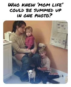 a woman and two children sitting on a toilet in a bathroom next to each other