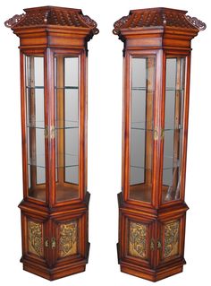 two tall wooden display cases with glass doors