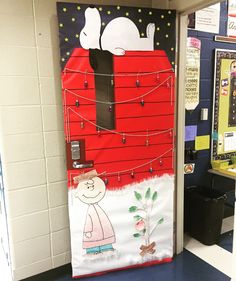 a door decorated to look like a santa's sleigh with cats on it