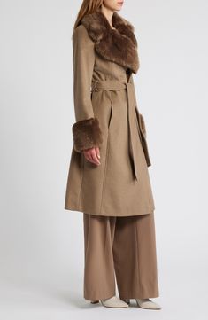 Luxuriously plush faux fur at the cuffs and collar brings a glamorous twist to your cold-weather ensembles in this sweeping longline coat cut from a rich wool blend. 43 1/2" length Hidden-button placket Notched lapels Side-seam pockets Removable tie belt Lined 65% wool, 30% polyester, 5% other fibers with 85% acrylic, 15% polyester faux fur Dry clean Imported Wool Fur Coat With Faux Fur Trim For Winter, Chic Wool Coat With Faux Fur Lining For Winter, Wool Coat With Faux Fur Trim For Winter, Winter Wool Coat With Faux Fur Trim, Elegant Wool Fur Coat With Faux Fur Lining, Chic Fall Wool Coat With Faux Fur Lining, Chic Wool Coat With Faux Fur Trim For Winter, Luxury Wool Outerwear With Faux Fur Trim, Wool Outerwear With Faux Fur Trim For Cold Weather