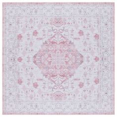 a pink and white rug with an ornate design on the bottom, in front of a white background