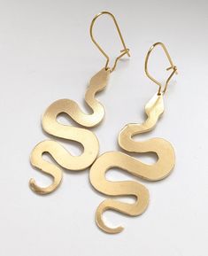 Brass Earrings with hook earrings. The hooks for the earrings are 14k gold plated stainless steel. The shapes are approximately 1" by 1". These are hand-cut, one by one, so both will be different. Each one will have a unique quality, but are cut around the same shape as displayed. **Earrings are made to order, and will be a new set of handmade earrings rather than the ones displayed. These are sawed, filed, sanded, and polished. These feel soft and smooth to the touch. All processes are completed by hand and with love. This item will come in a gift box. It may take 1-2 weeks to ship, and will arrive by USPS. Alien Head, Snake Earrings, Jewellery Design, Brass Earrings, Be Different, Hook Earrings, New Set, Handmade Earrings, Sterling Silver Earrings