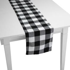 a black and white checkered table runner