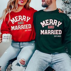 You will love this Merry and Married Sweatshirt as you enjoy your first holiday season as a married couple. You can even add your wedding date!  Ideal for any situation, a unisex heavy blend crewneck sweatshirt is pure comfort. These garments are made from polyester and cotton. This combination helps designs come out looking fresh and beautiful. The collar is ribbed knit, so it retains its shape even after washing. There are no itchy side seams on these sweaters.  .: Made with a medium-heavy fabric blend of 50% cotton and 50% polyester (8.0 oz/yd² (271.25 g/m this sweatshirt feels cozy and is the perfect choice for those colder months. .: The classic fit along with the crew neckline deliver a comfy wearing experience with a clean-cut style. Meanwhile, the double-needle stitching at the sho Xmas Couple, Christmas Pregnancy Announcement, Matching Christmas Shirts, Santa Sweatshirt, Couples Sweatshirts, Funny Holiday, Matching Sweatshirts, Christmas Funny, Christmas Couple