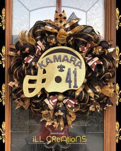 Black and gold New Orleans Saints wreath in honor of running back Alvin Kamara. Saints Wreaths, Saints Wreath, Alvin Kamara, Running Back, New Orleans Saints, Wired Ribbon, Door Wreath Hanger, Deco Mesh, Door Wreaths