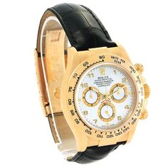 Men's Rolex 40mm Daytona 18K Yellow Gold Watch with Black Leather Strap and White Dial. Pre-Owned SN# Y94**** Brand: Rolex. Gender: Men's. Model: Daytona. Type: Wristwatch. Case Size: 40mm. Dial Color: White. Bezel Color: Gold. Condition: Excellent. Band/Strap: Leather. Indices: Non-Numeric. Band Material: Leather. Bezel Type: Unidirectional Rotating. Water Resistance: 100 m (10 ATM). Movement: Mechanical (Automatic). Hour Marks: Round / Baton Indexes. Box / Certificate: Rolex Box / Certificate