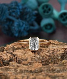 a close up of a ring on a rock