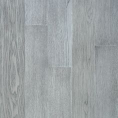 an image of wood flooring that looks like it has been painted in light gray