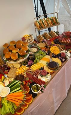 a buffet table filled with lots of different types of food on it's sides