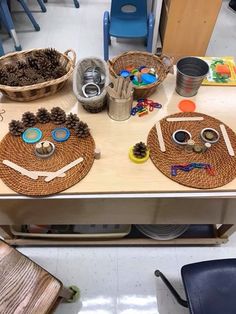 the table is set up with baskets and other items for children's arts and crafts