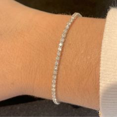 Gorgeous Dainty Bridal Themed Tennis Bracelet Made With Ethical Lab Grown Diamonds Totaling In 2.25 Carats Made In Solid 10 Karat White Gold The Length Of The Bracelet Is 7.25 Inches Marked 10k Secured Clasp 100% Guaranteed Bridal Bracelet Tennis Bracelet Diamond Bracelet Diamond Tennis Bracelet Bridal Tennis Bracelet, Tennis Bracelet White Gold, Small Tennis Bracelet, White Gold Tennis Bracelet, Hand Set White Gold Round Bracelet, White Diamond Jubilee Bracelet, White Diamond Bracelet With Round Diamond Cut, White Round Diamond Bracelet With Diamond Cut, White Diamond Bracelet With Round Cut