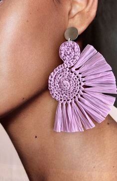 These Handcrafted Lavender Raffia Earrings are the perfect addition to any boho-inspired outfit. Made with love and attention to detail, each earring features a unique spiral shape, giving a touch of elegance and playfulness. The vibrant purple color will effortlessly complement any skin tone, making them perfect for any occasion. The fringes add a trendy and stylish touch, adding movement and texture to your look. With their unique design and boho style, these earrings are a must-have accessory Purple Handwoven Earrings As A Gift, Purple Bohemian Earrings For Beach, Handmade Adjustable Lavender Earrings, Purple Earrings For Summer Beach, Light Purple Earrings, Jewellery Patterns, Raffia Earrings, Boho Style Accessories, Spiral Shape