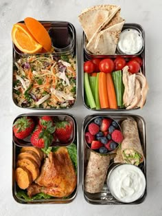 four trays filled with different types of food including fruit, veggies and bread