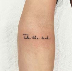 a woman's arm with the words take the rest tattooed on it