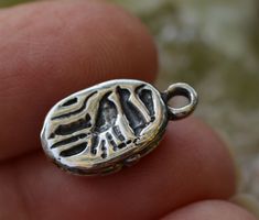 The Ancient Egyptian scarab is a symbol of rebirth and resurrection...as well as good luck and fortune!  These are solid sterling silver and weigh nearly 7 grams each. -Size 15.5mm x 10mm (measure does not include loop) -These are thick!  6.5mm thick -Overall length including the loop is 19.5mm -Sterling Silver -Authentic reproduction of a Vintage Scarab from Egypt -Option to have us attach a jump ring for you:  Standard round 16g with 5mm ID  Shop with confidence! We offer a money back guarantee on all of our artisan pieces. If you aren't happy for any reason, just return within 14 days. Please note that ALL of our sterling silver is .925 which is 92.5% silver and 7.5% copper. Antique Silver Jewelry For Blessing, Dove With Olive Branch, Amulet Charm, Egyptian Scarab, Heart With Wings, Bird Charm, Beautiful Heart, Ancient Egyptian, Jump Rings