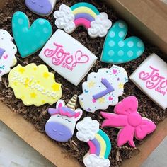 some decorated cookies in a box on a table