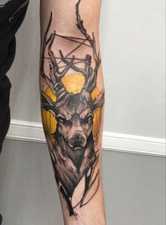 a man with a deer tattoo on his leg