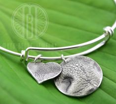 TWO Dog Nose Print Charms in Pure Silver, ONE sterling silver bangle bracelet - Maya Belle Jewelry Silver Paw Print Jewelry For Anniversary, Silver Jewelry With Paw Print For Anniversary, Silver Anniversary Jewelry With Paw Print, Adjustable Paw Print Jewelry For Anniversary, Adjustable Silver Jewelry With Paw Print, Adjustable Sterling Silver Paw Print Jewelry, Adjustable Sterling Silver Jewelry With Paw Print, Silver Jewelry With Paw Print, Adjustable Paw Print Jewelry Gift