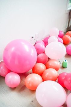 pink and orange balloons laying on the floor