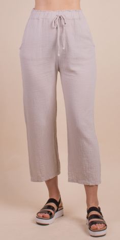 Lightweight and Breathable Waffle Cotton Pants. Features an Elastic Faux Tie Waist and Pockets. Make it a Set with the Jesi Cotton Top. 100% Cotton Made in Italy One Size Model 5'7" Chic Cropped Leg Loungewear Pants, Chic Cropped Leg Lounge Pants, Cropped Leg Pull-on Bottoms For Loungewear, Pull-on Style Cropped Leg Bottoms For Loungewear, Cropped Leg Bottoms With Elastic Waistband For Daywear, Spring Loungewear Cropped Pants, Spring Loungewear Capris, Cropped Leg Pants With Elastic Waistband For Loungewear, Spring Loungewear Straight Capris