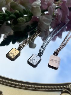 "This gorgeous Tarnish resistant Velaris necklace is inspired by the Sarah J Maas series ACOTAR. Take a small piece of home with you wherever you go with this gorgeous engraved double sided Necklace  Front depicts Velaris Back- \"Take me home to Velaris\" Choose from Silver, Gold or Rose tone stainless steel. Necklace Chain measures at 45cm + 5cm extender Pendant approximately 18mmx11mm Material: Tarnish resistant stainless steel From A Court of Mist and Fury, by Sarah J. Maas, © 2016. Artwork by Miss T Creations AU. Created with permission of Writers House LLC acting as agent for the author. The art depicted on the products listed for sale is wholly original to me and has been approved by Sarah J. Maas for use on the products. Notwithstanding such approval, Sarah J. Maas has not collabora Stainless Steel Pendant Necklaces With Engraving Option, Stainless Steel Pendant Necklace With Engraving Option, Engraved Stainless Steel Necklace With Adjustable Fit, Etched Stainless Steel Necklace As Gift, Etched Stainless Steel Necklace For Gift, Adjustable Stainless Steel Engraved Necklace, Velaris Ring, Adjustable Engraved Stainless Steel Necklace, Acotar Necklace