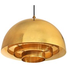 a gold colored light fixture hanging from a ceiling