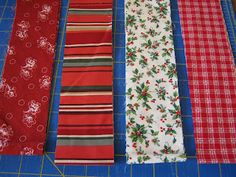 four different colored ties laid out on a cutting board