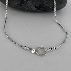 Stylish and versatile, this sterling silver box chain necklace boasts a front circle clasp, ideal for interchangeable charms and pendants. Chain: Solid 925 Italian Sterling Silver Rounded Box Chain Necklace, 1.8mm width Clasp: Solid 925 Sterling Silver 10mm Hinged Round Push Clasp, ideal for interchangeable pendants and charms Ships within one business day and free shipping in the USA Take a look inside my store:  https://www.etsy.com/shop/LagunaLifeDesigns Box Chain Necklace, Clasp Necklace, Round Box, Silver Box, Laguna Beach, Box Chain, Necklace Gift, Solid 925 Sterling Silver, Gift Necklace