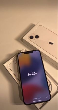 an iphone is sitting in a box with the name hello written on its back side